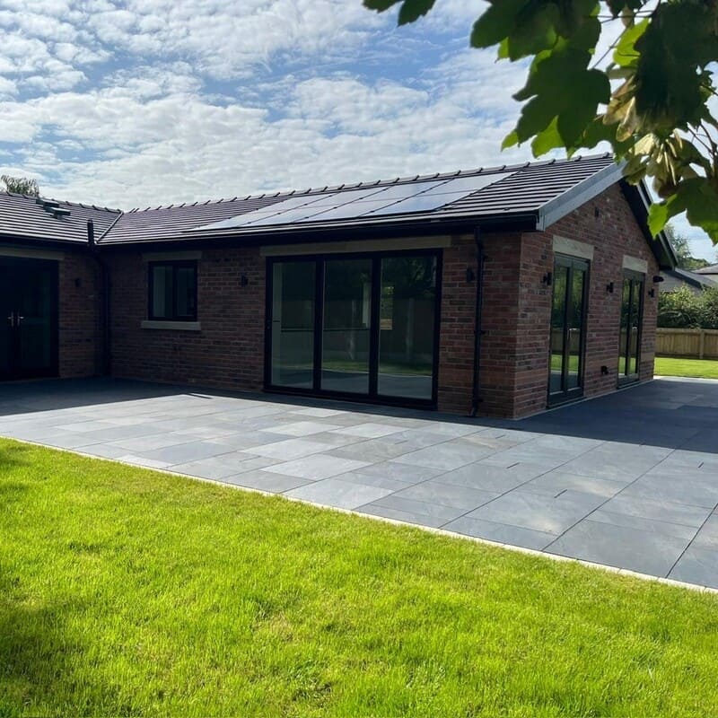 Photo shows spacious outdoor space and garden of this new-build residential development